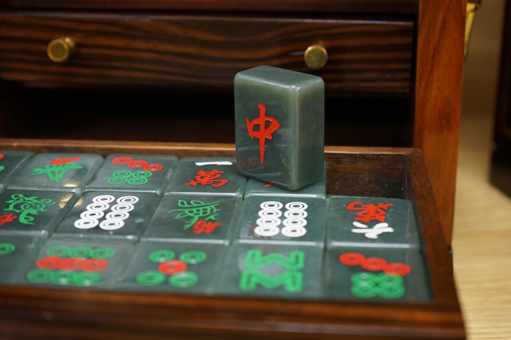 Two mahogany-cased hardstone mahjong sets, 22.5cm tall